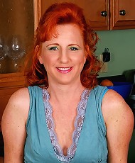 All natural red headed MILF shows off her sexy feet and hairy pussy